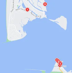 screenshot of yelp search results, showing interest markers on two peninsulas on either side of a body of water